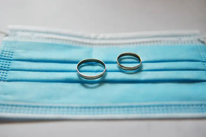 A surgical masks with two wedding bands